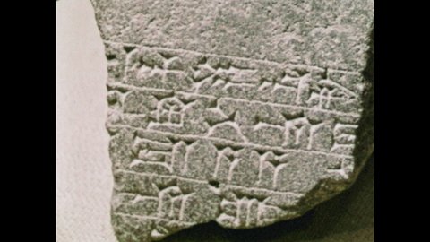 1960s: object Figurine in museum. Vase. Cuneiform on stone. Person walks through ancient ruins of city of Hazor. Map shows path through Middle East ancient Hebrews took.