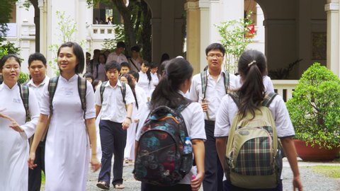 SAIGON, VIETNAM - MARCH 18, 2013: Students of Le Hong Phong High School leaving the School for Lunch Break