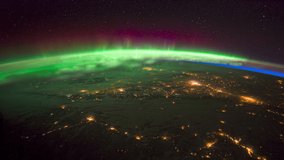 ISS Time-lapse Video of Earth seen from the International Space Station with dark sky and Aurora Borealis at night over Canada, Time Lapse 4K. Images courtesy of NASA. Pan down motion timelapse. 