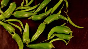 Thick green chillies and fine green chillies, green chili on black background,green chili hd footage clip,Indian spice Red chilli and vegetable green chilli