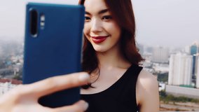 Traveler Asian blogger women travel in city Bangkok, Thailand, beautiful female using mobile phone make vlog and live in social media .woman tourist making video call with smartphone while traveling.