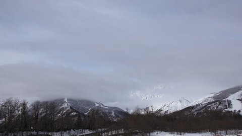 Snow mountains with clouds and mist is beautiful landscape by time-lapse in Hakuba, Japan.