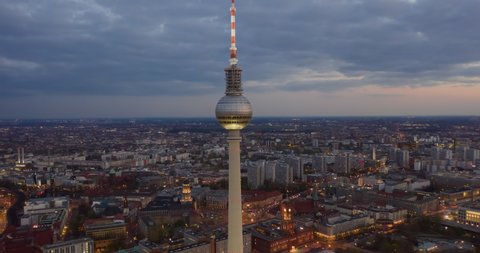 Day to Night Aerial Hyperlapse, Motion Time Lapse of Berlin TV Tower Establishing Shot and beautiful city lights, Hyper Lapse
