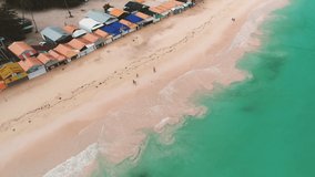 Seascape. Shopping center on the beach with many color bungalows, aerial view over Punta Cana resort, Dominican Republic.