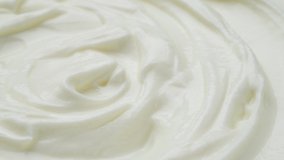Sour cream macro, fresh greek yogurt swirl close up, whipped cream