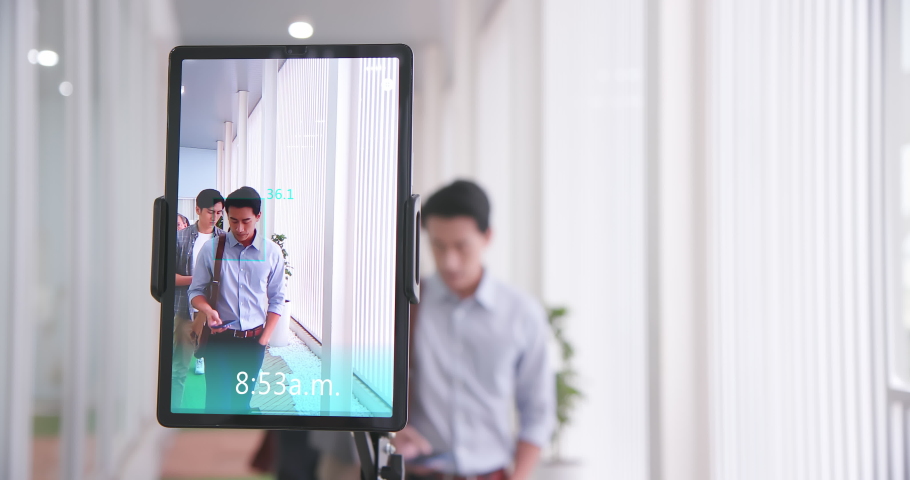 facial recognition concept - Asian businessman using face scanner to clock in work and check body temperature Royalty-Free Stock Footage #1068614387