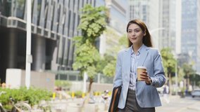 successful young asian woman walking in central business district  in modern city - Powered by Shutterstock - Get 15% off with code: PIKWIZARD15