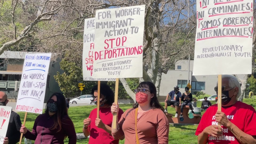 Protesters holding signs take part in a rally to demand the end of deportations in U.S. immigration policy, at Silver Lake Reservoir in Los Angeles, California, March 6, 2021.
