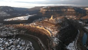 Aerial video around Tsarevets Hill with the Patriarchal Church and part of Veliko Tarnovo town with Yantra river, Bulgaria