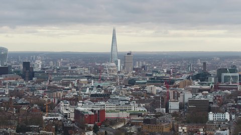 Establishing Aerial View Shot of London UK, United Kingdom, overcast and sunny patches, midday