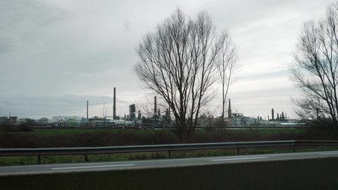 Oil Refinery. View from Car Window Moving Along Highway. La Havre France Europe. Slow motion