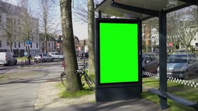 Bus stop advertising green screen slow motion