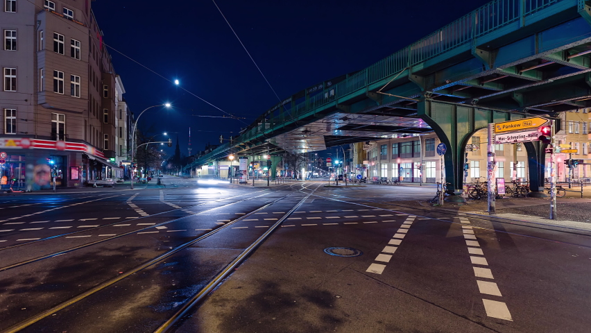 Night Time Lapse of Eberswalder Strasse with subway trams and cars Berlin, Germany
