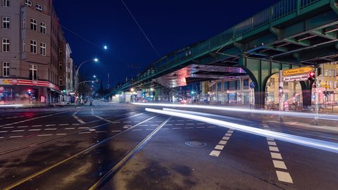 Night Time Lapse of Eberswalder Strasse with subway trams and cars Berlin, Germany