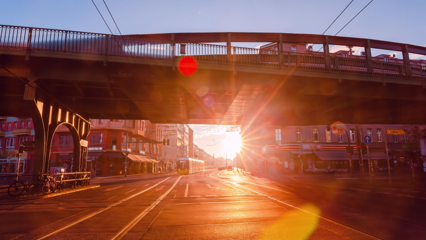 Sunrise Time Lapse of Eberswalder Strasse with subway trams and cars Berlin, Germany