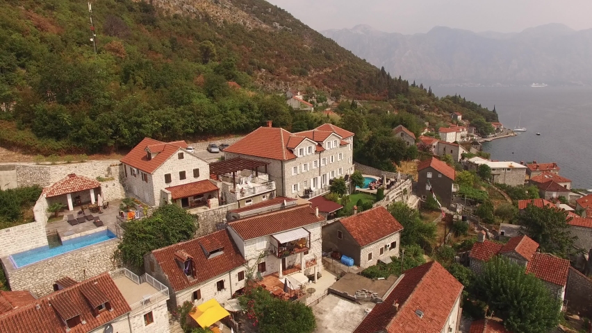 Aerial view of buildings of the old town of Perast | Shutterstock HD Video #1068634856