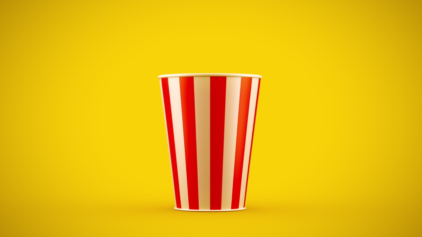 Popcorn falling out of a red-white striped bucket on a yellow background, nice background (4K,ultra high definition 2160p)