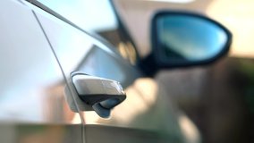 Businessman Opens Luxury Car Door With Remote Key And Enters - Powered by Shutterstock - Get 15% off with code: PIKWIZARD15