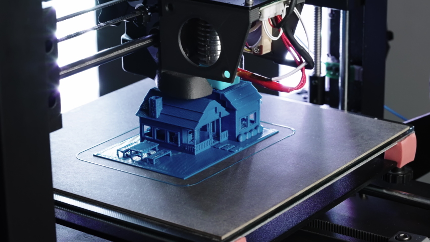 Close up of 3d Printer printing small blue house shot in 4k Royalty-Free Stock Footage #1068644078