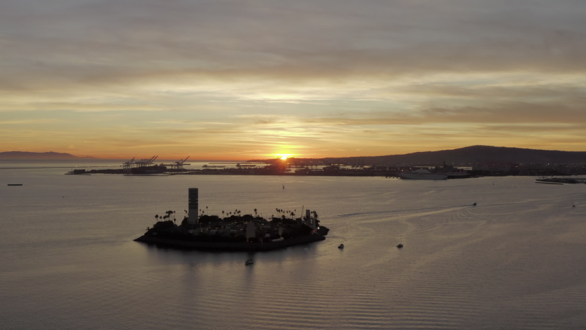 Aerial Pan Left To Right: Sun Setting By The Beach