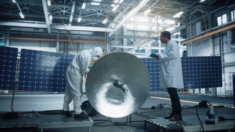 Team of Engineers Working on Satellite Construction. Aerospace Agency Spaceship Manufacturing Factory: Diverse Group of Scientists Developing Spacecraft for Global Space Exploration Program