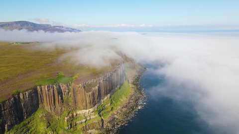 Kilt rock flying above fog, Isle of Skye, Scotland