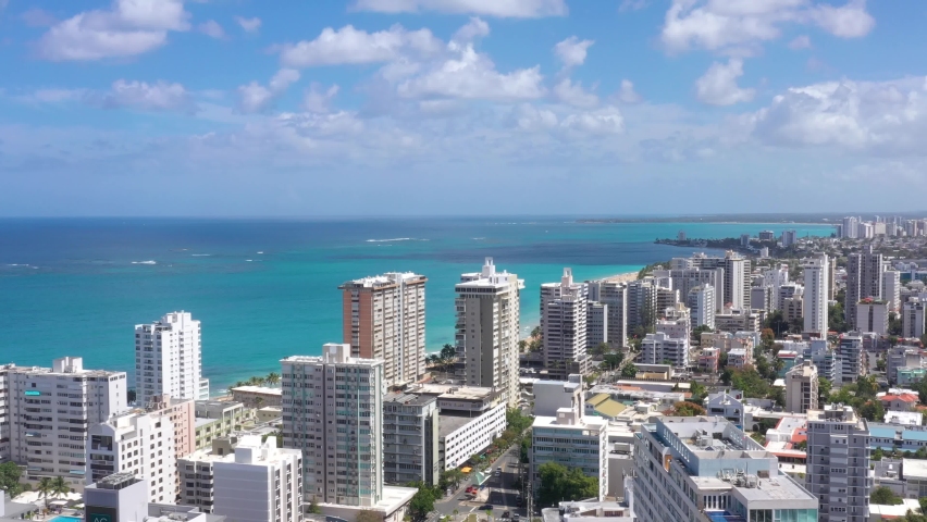 San Juan Puerto Rico Condado Parroquia Stella Maris Catholic Church Cinematic Drone Shot with colorful beach and cristal clear sky 2