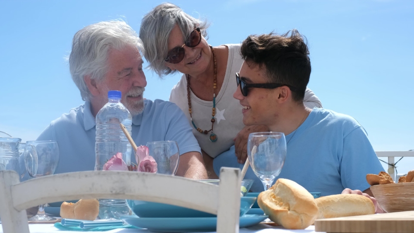 Happy couple having lunch with son un a sunny summer day Royalty-Free Stock Footage #1068661208