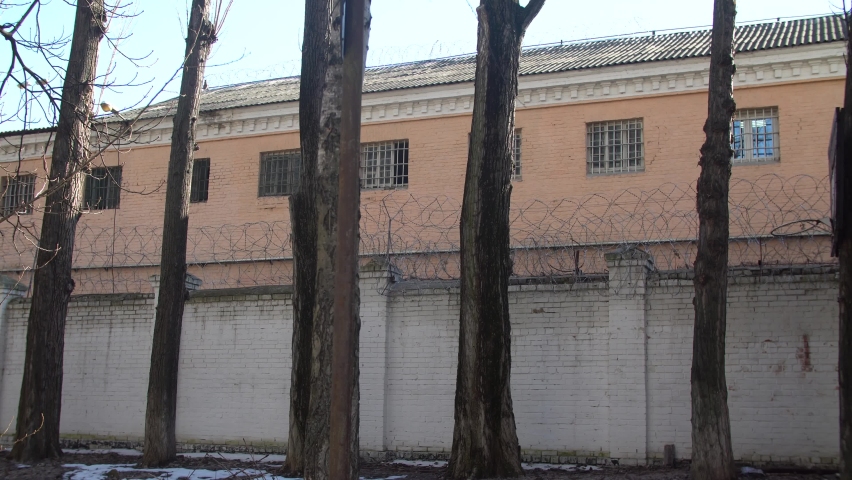 fence around the prison. barbed wire fences high fence, prevents prisoners from escaping
