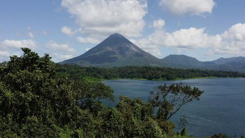 Drone footage over Lake Arenal in Costa Rica with Arenal volcano in background