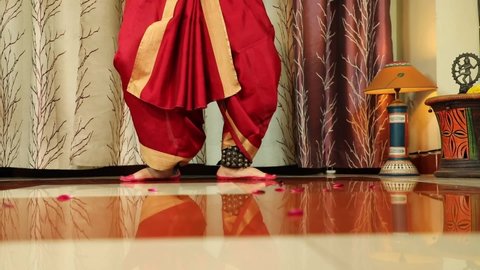 Foot Steps Works of Indian Classical Bharatnatyam Female Girl Lady Dancer In Red Costume With Ghungroo Ghungru Or Noopura Which Is A Musical Anklet To Tie On The Feet Painted With Alta Red Dye Altha A