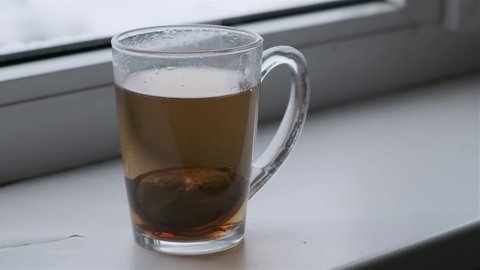 black tea in a glass slow motion video
