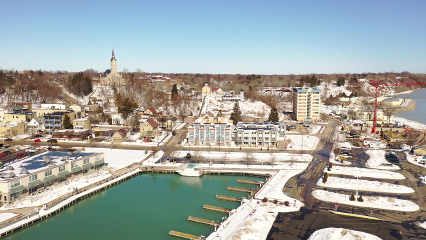 Aerial view of town of Port Washington, Wisconsin. Daytime, sunny sky, winter.