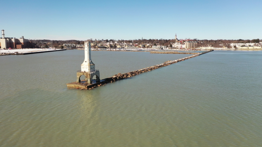 Aerial view of a lighthouse in Port Washington, Wisconsin. Daytime, sunny, winter, lake Michigan