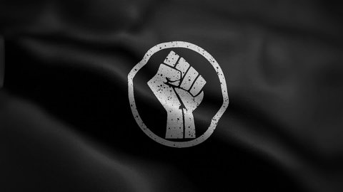 Frontal view of the Black and White Fist of Power Flag flapping in HD.