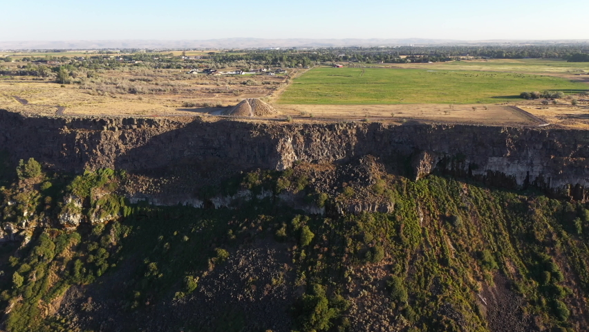 Drone camera gliding toward the historic Evel Knievel jump site on the edge of the Snake River Canyon in Twin Falls, Idaho. 