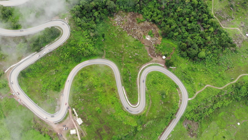 Aerial top view 4K drone shot above the mountain road and cloud  | Shutterstock HD Video #1068695756