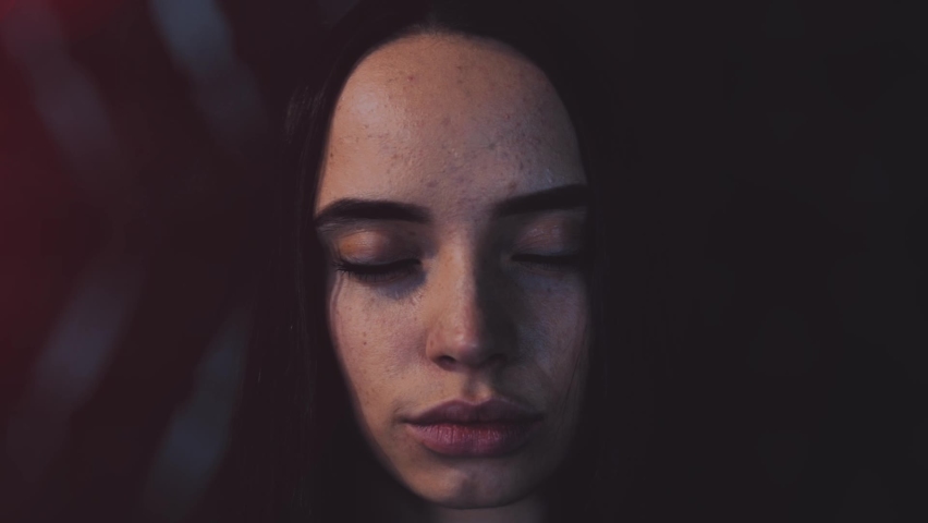 Close up portrait of woman with chip integrated in to the her eye. VR concept. Camera zooming to female face. Futuristic concept video. - Powered by Shutterstock - Get 15% off with code: PIKWIZARD15