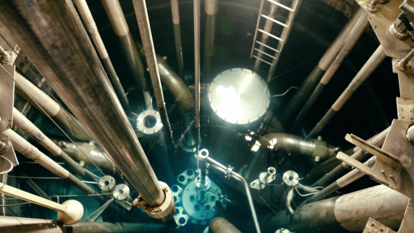 Nuclear reactor close-up. The camera slides down smoothly. Royalty-Free Stock Footage #1068700196