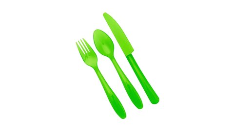 Stop motion animation with colored cutlery for use in infographics on kitchen topics. Changing the color of cutlery on a white background. For promotional demonstration of products. 4K, 25p. Stop