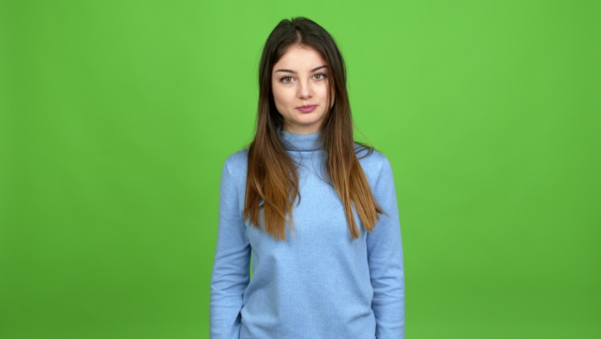 Young caucasian woman showing and lifting a finger in sign of the best over isolated background. Green screen chroma key Royalty-Free Stock Footage #1068719120