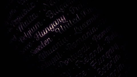Reflective words of member states of european union flying in air arranged in sparse rows. Handwritten typography of all 28 eu countries in 2015. Looping animation in 4k resolution.