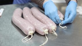 Production of sausage in the production in the meat shop. Gastronomic products.