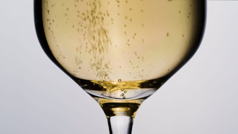 Sparkling white wine champagne or cava in champagne glass with bubbles