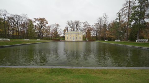 PUSHKIN, RUSSIA - OCTOBER, 24, 2020: Catherine Palace and Park in autumn, Tsarskoye Selo, Mirror Pond and Upper Bathhouse, outstanding landmark of the Russian culture near Saint Petersburg.