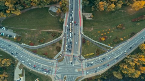 Transportation and Infrastructure: Aerial View of Road Traffic Jam in Warsaw, Poland, Europe. Suspension Bridge with Multiple Lane Highway Interchange and Junction with Cars. Tracking shot