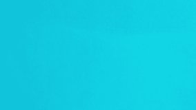 Blue paper opening ripping to reveal black copy space. Paper ripping into scrolls, opening window in front of black surface to make copy space for your important messages. Stop-motion - Powered by Shutterstock - Get 15% off with code: PIKWIZARD15