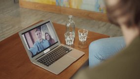 Young couple on home isolation video chatting with happy friends from all world, virtual meeting young students people having fun in online video call due to social distancing quarantine