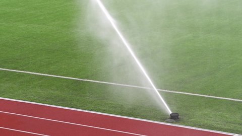 water the football field in slow motion