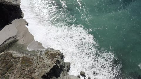 Californian Big Sur rugged coastline, waves crashing against shoreline, aerial